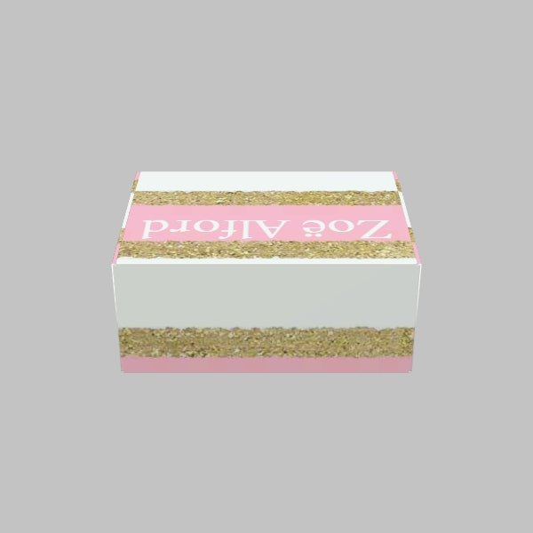 A rectangular pink and white Custom Mailer Box with gold glitter stripes, labeled "105 Packaging" on the top.