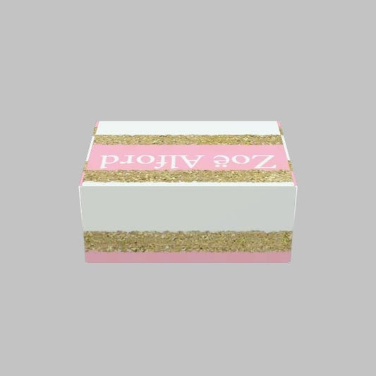 A rectangular pink and white Custom Mailer Box with gold glitter stripes, labeled "105 Packaging" on the top.