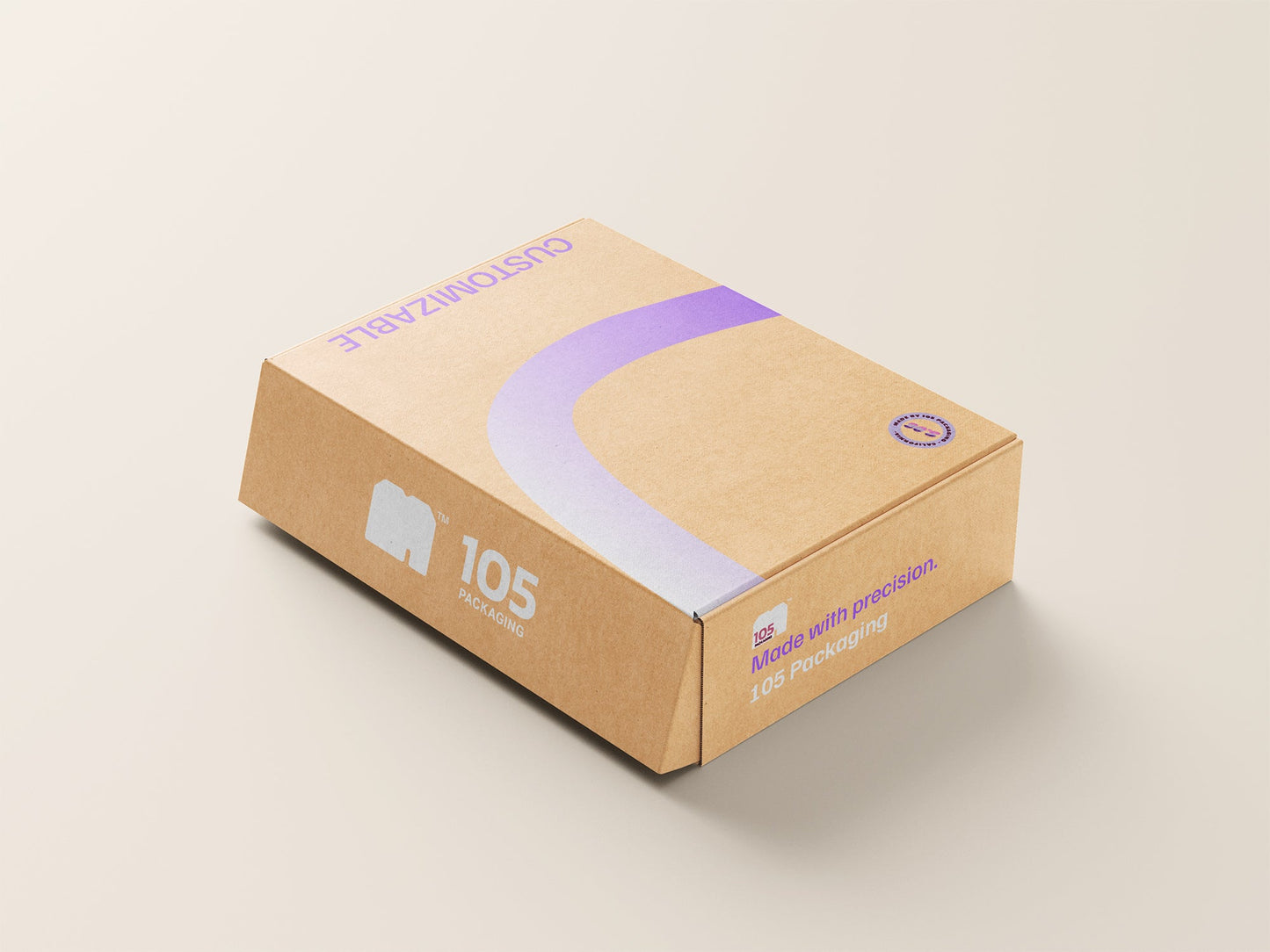 A brown cardboard box labeled "Custom Mailer Box" in purple print on a beige surface. The box proudly displays the "105 Packaging" brand name and a camera icon, along with a quality seal and the text "Made with Precision.